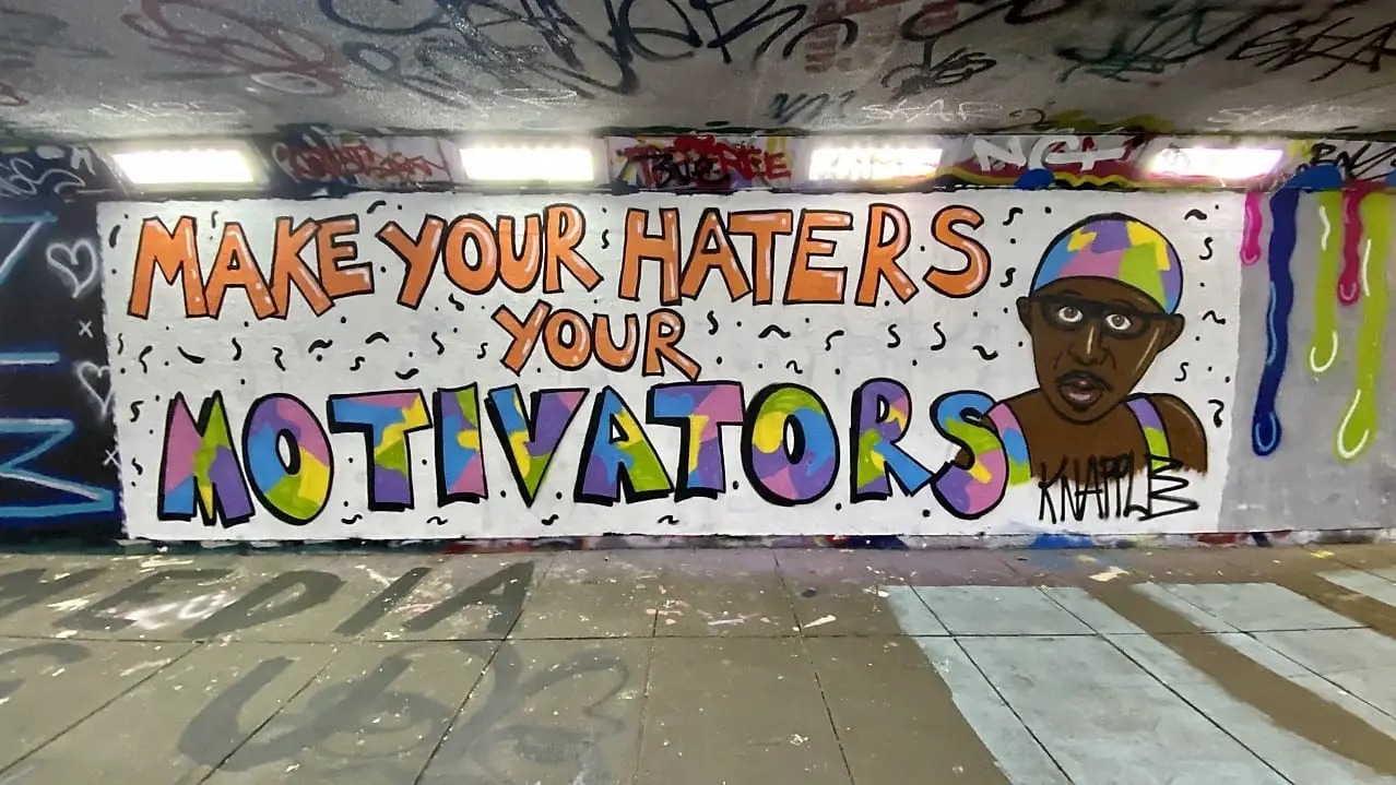 example of street art in Norwich, this mural was found in the Pottergate underpass and says "make your haters your motivators"