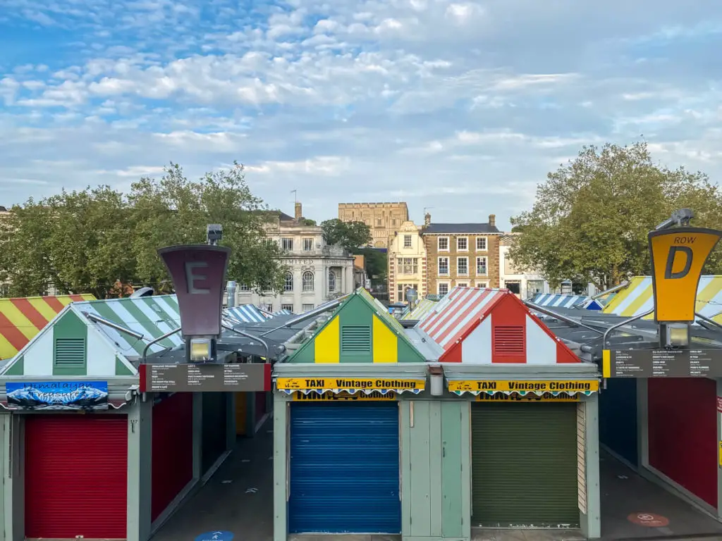 two of the best things to do in norwich: norwich market with norwich castle in the background