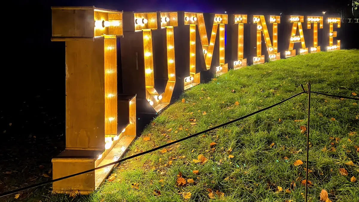 Illuminated sign that says Luminate from the start of the Luminate Light trail at Sandringham