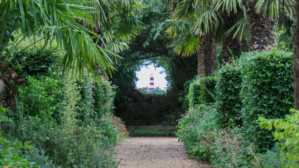 view of the happisburgh lighthouse from the old vicarage garden in Norfolk.