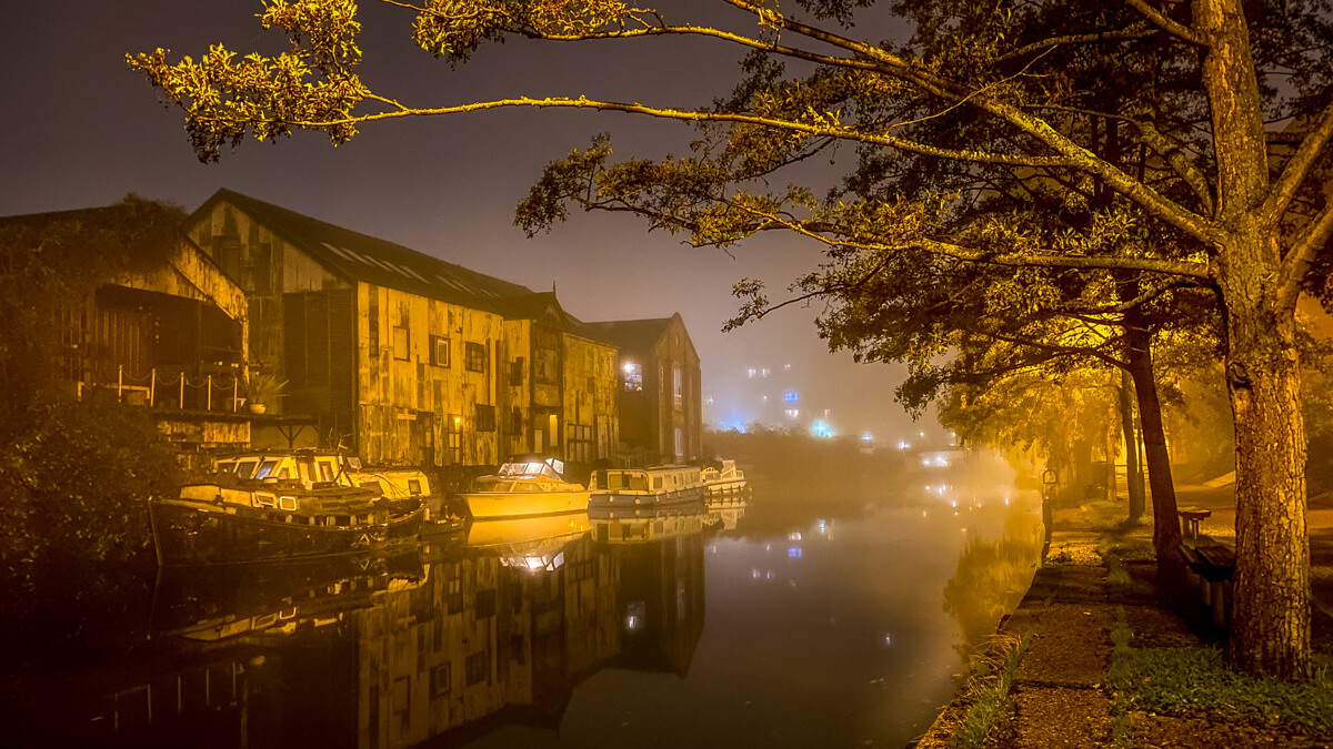 river wensum in the riverside area of norwich on a misty night
