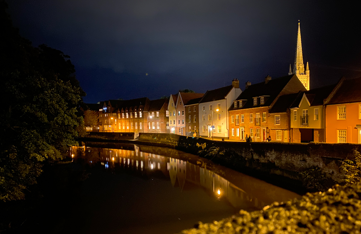 Norwich Quayside at night with Cathedral in the distance