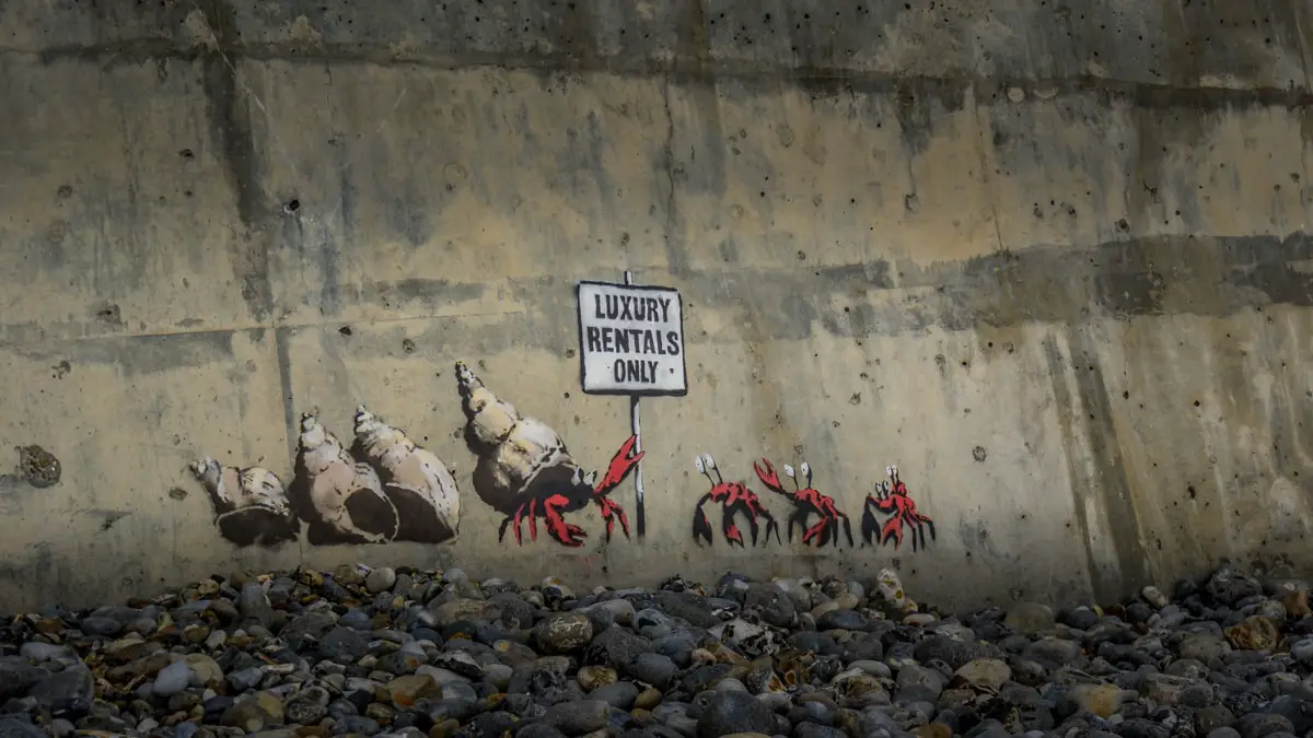 Banksy artwork in Cromer Norfolk, hermit crabs with a sign that says luxury rentals only