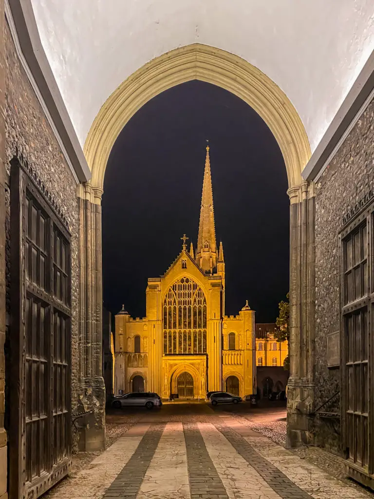 looking through the erpingham gate at Norwich Cathedral at night