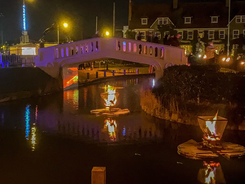 bridge at the venetian waterways with fire during fire on the water