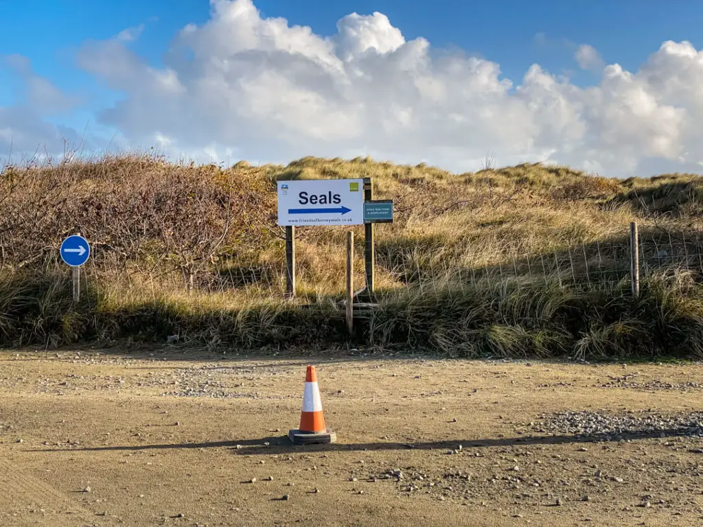 sign directing people which way to go to see the seals at Horsey