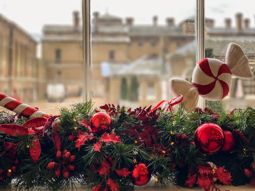 christmas decorations with view of Holkham Hall through the window