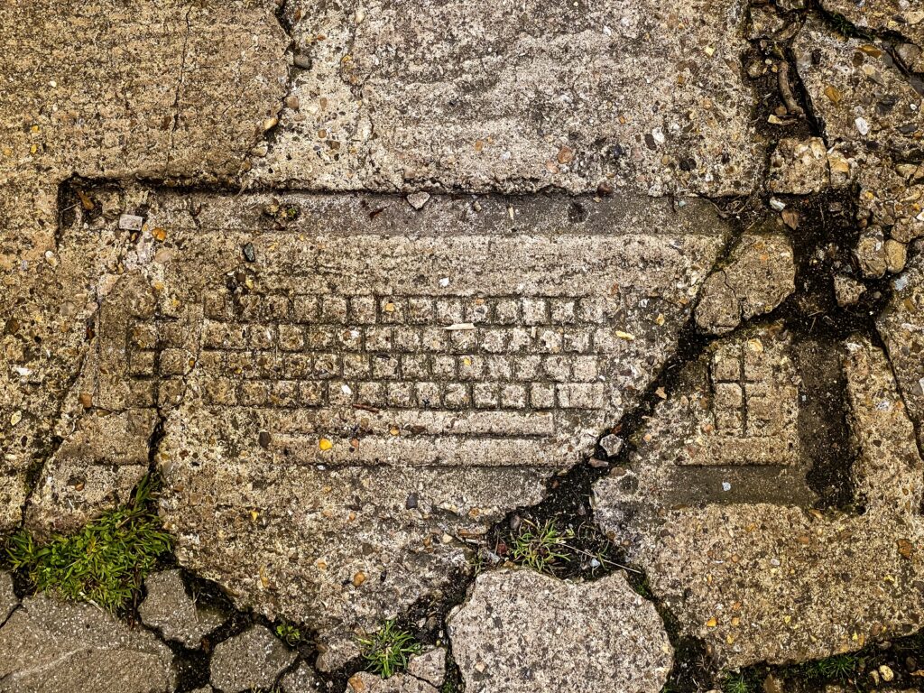 fossilised keyboard in the pavement in Norwich