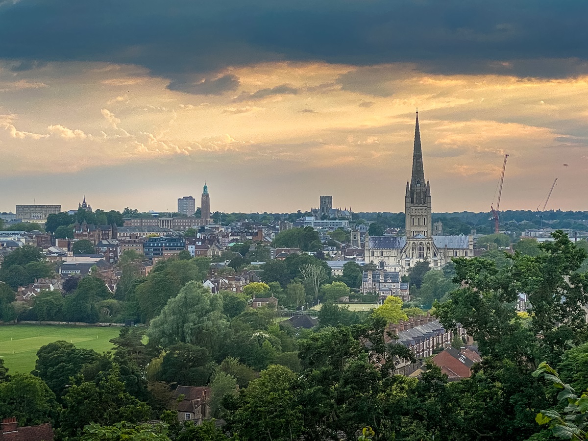 view of norwich with cathedral dominating and a dramatic sky