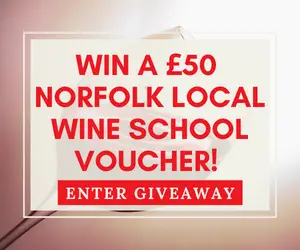 wine glass with text overlay win a 50 norfolk wine school voucher