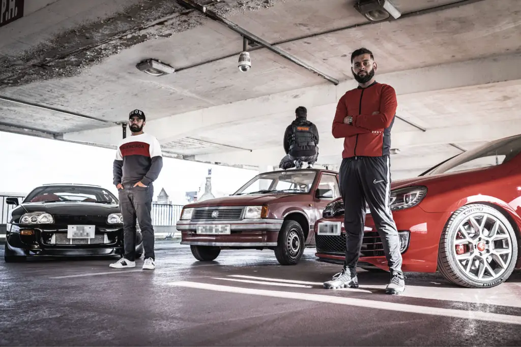 peaceophobia - three men with cars in car park