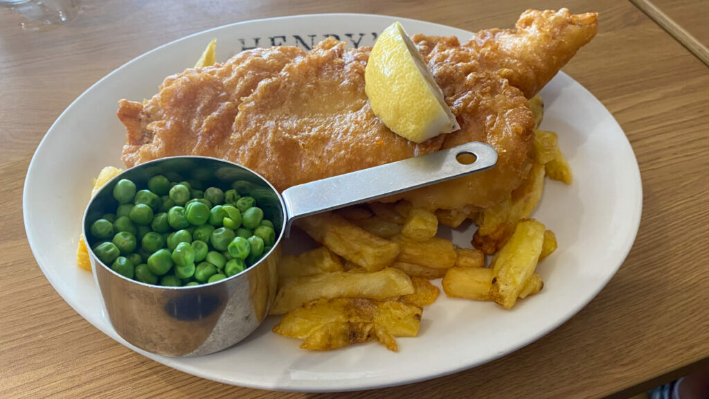 plate of fish and chips with garden peas at Henry's of Hunstanton