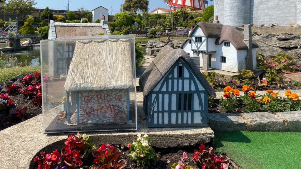 replica of the banksy house at the merrivale model village