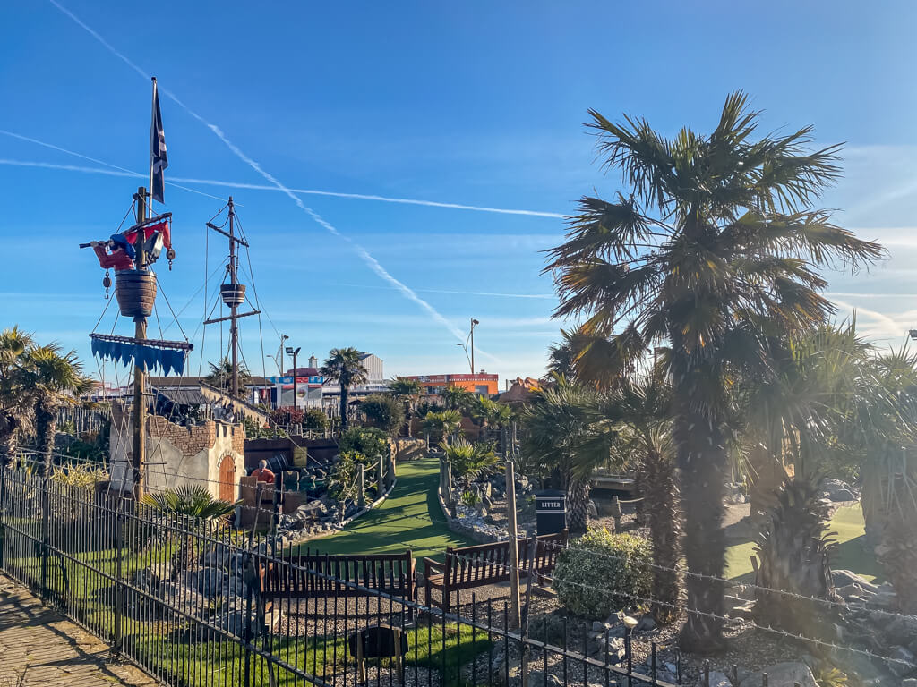 pirate-themed mini golf course with a pirate ship