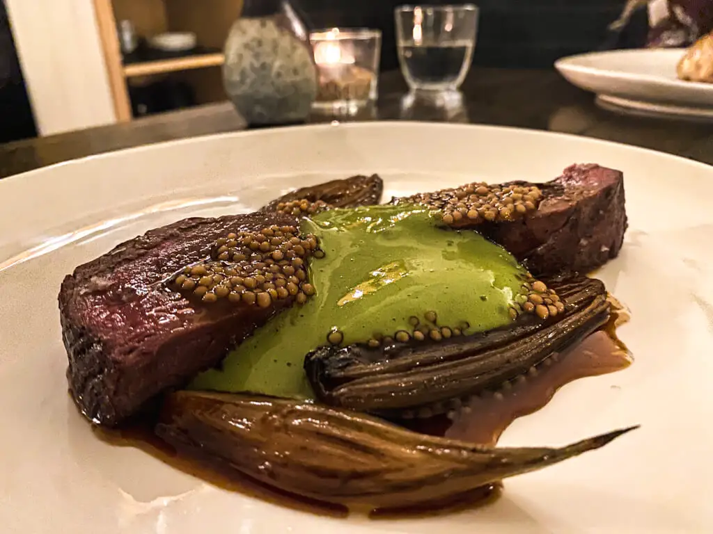 main course of deer on a white plate at benedicts in norwich