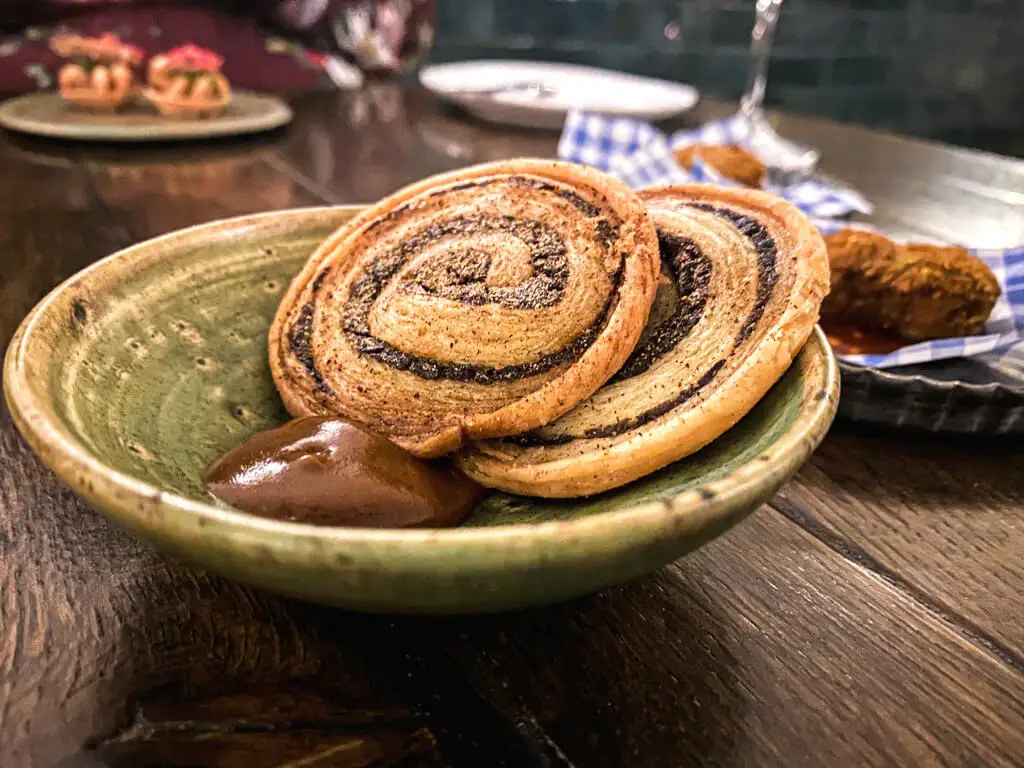 mushroom twizzlers on a plate with a brown sauce