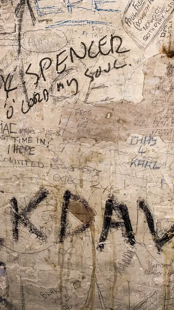 close up of graffiti in the gaol in the norwich guildhall