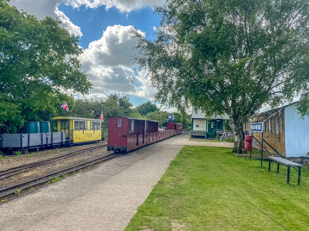 wells station for the wells walsingham light railway with a few trains
