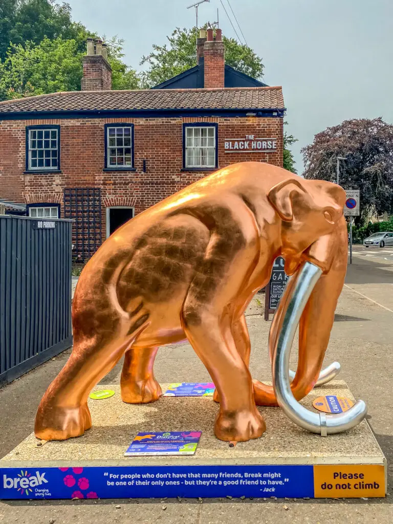 copper coloured mammoth with silver tusks