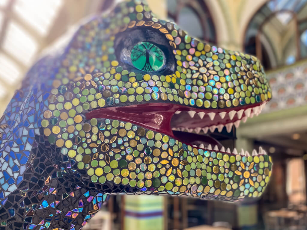 closeup of Arcadia t-rex with mosaic details