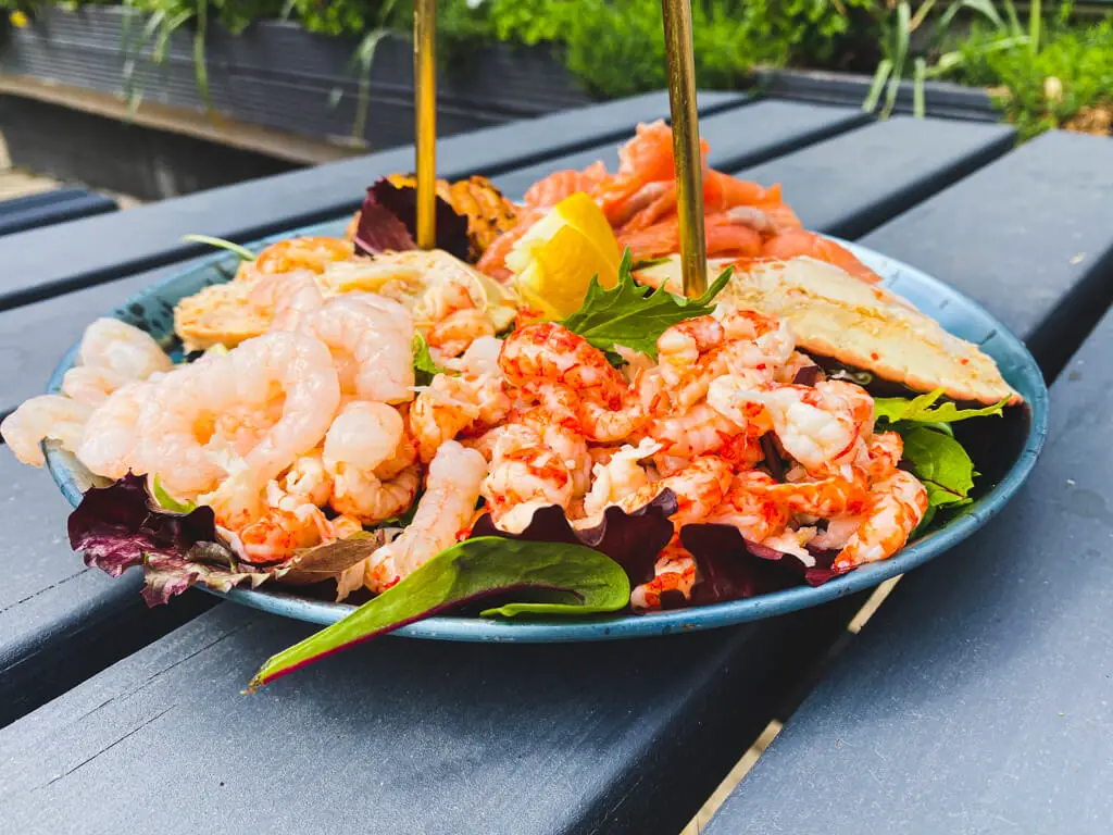 the bottom level of the seafood plater with prawns, crab, crayfish, salmon