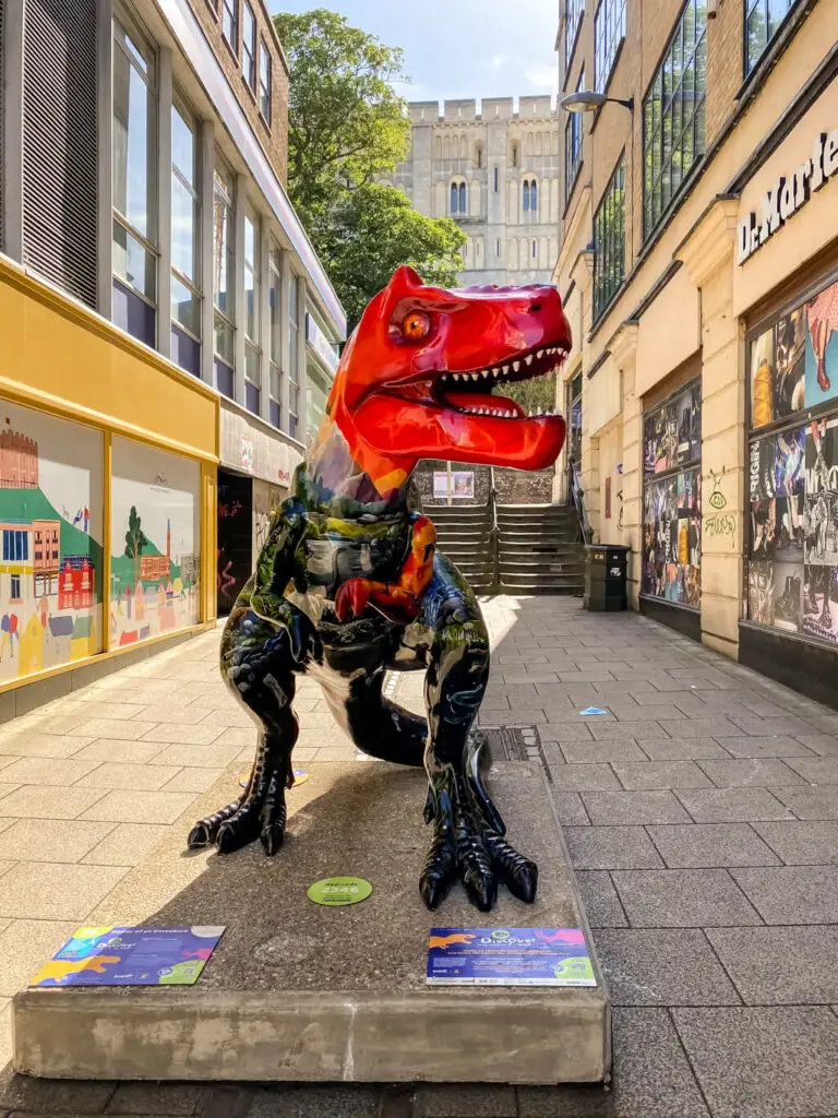 t-rex with norwich castle in the background