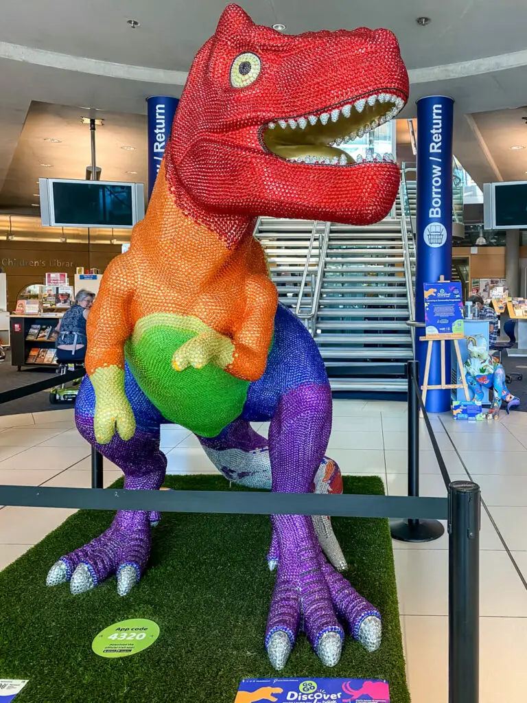 rainbow prideasaurus inside the Norwich Millenium Library