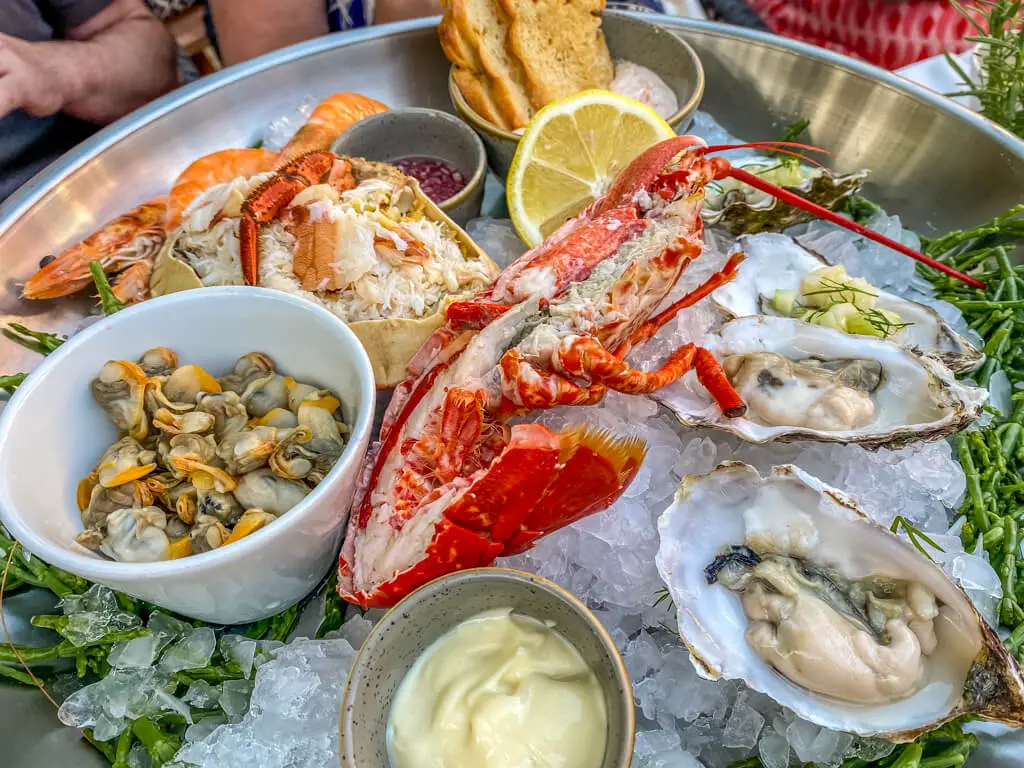 view of coastal platter from globe inn, with lobster, crab, cockles, prawns, and more