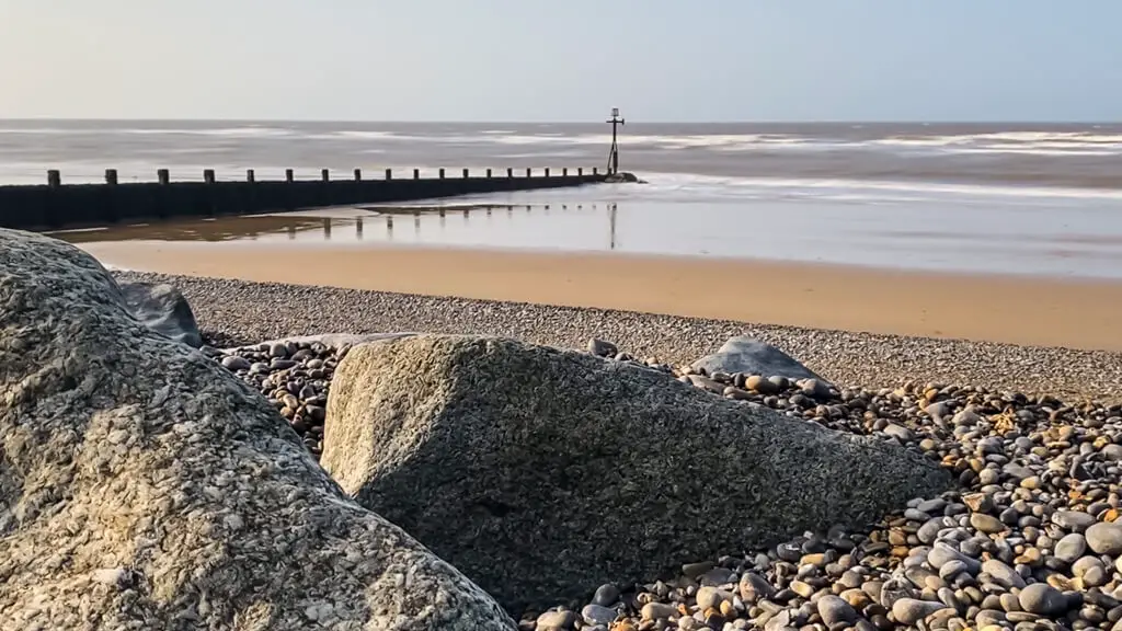 sheringham beach with rocks and sand