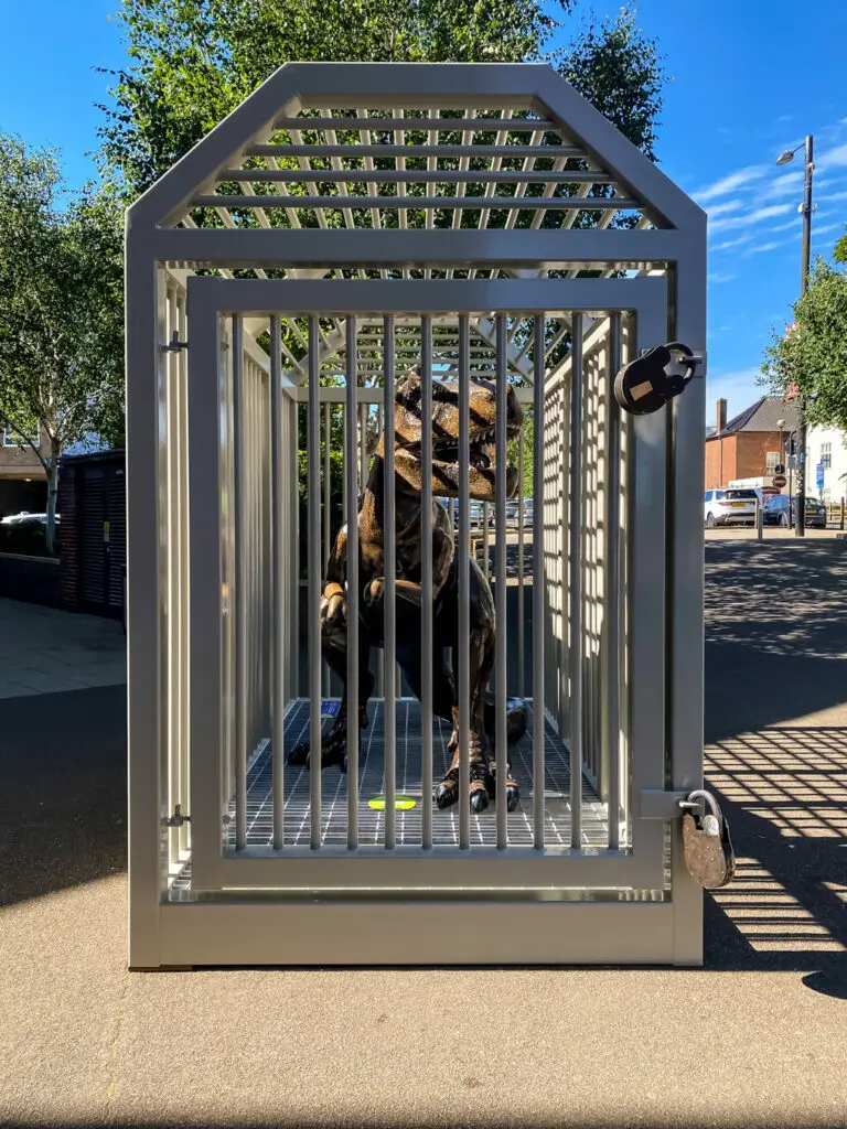 t-rex in a huge cage