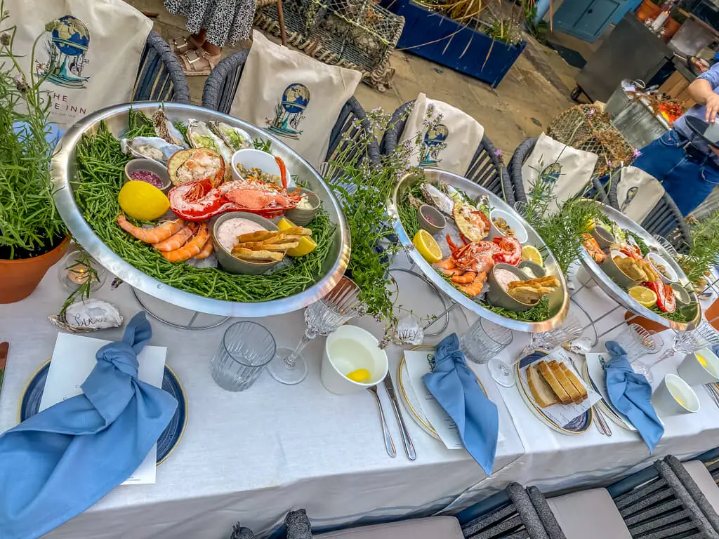 nicely decorated table with several seafood platters