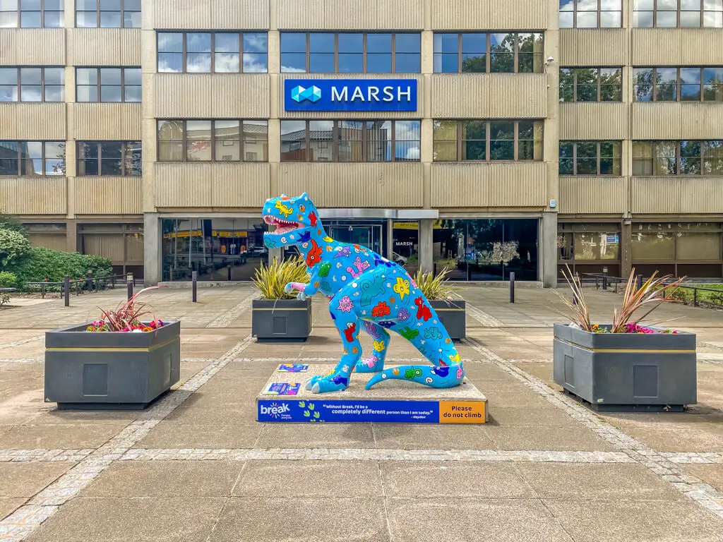 yoodle saurus in front of the marsh building