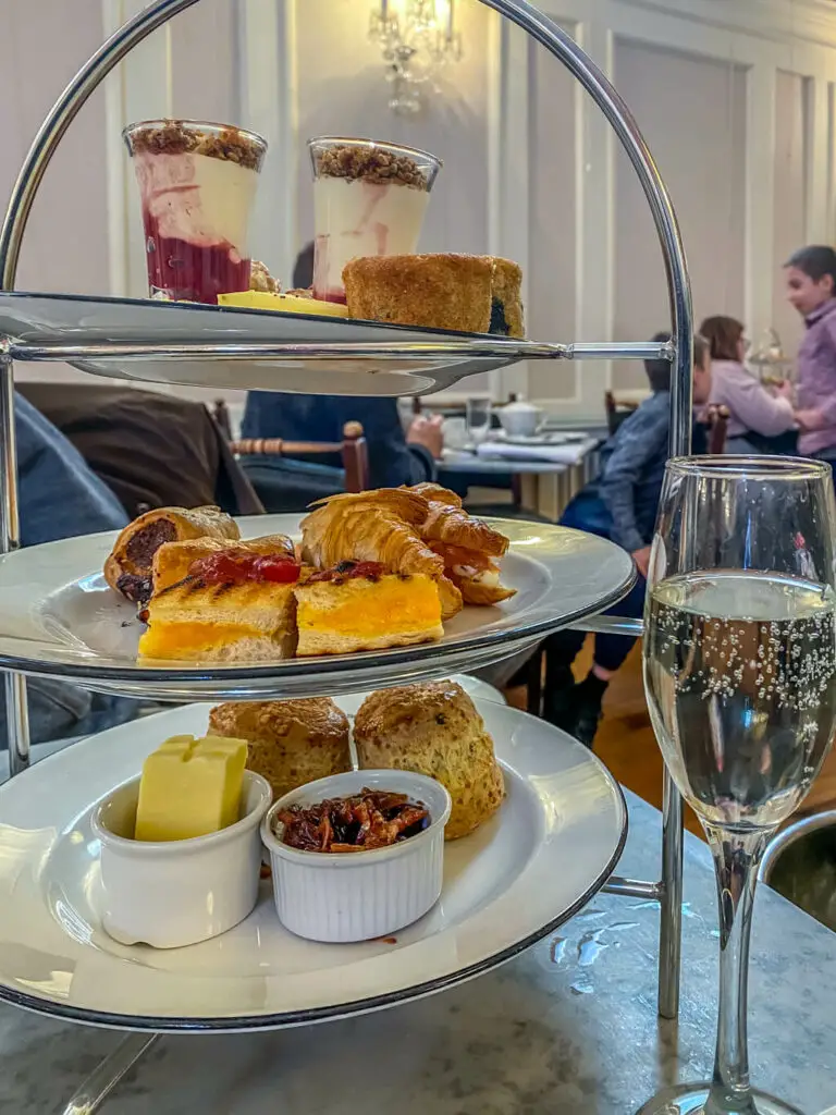 the three tiered tray of beforenoon tea from the assembly house with a glass of prosecco