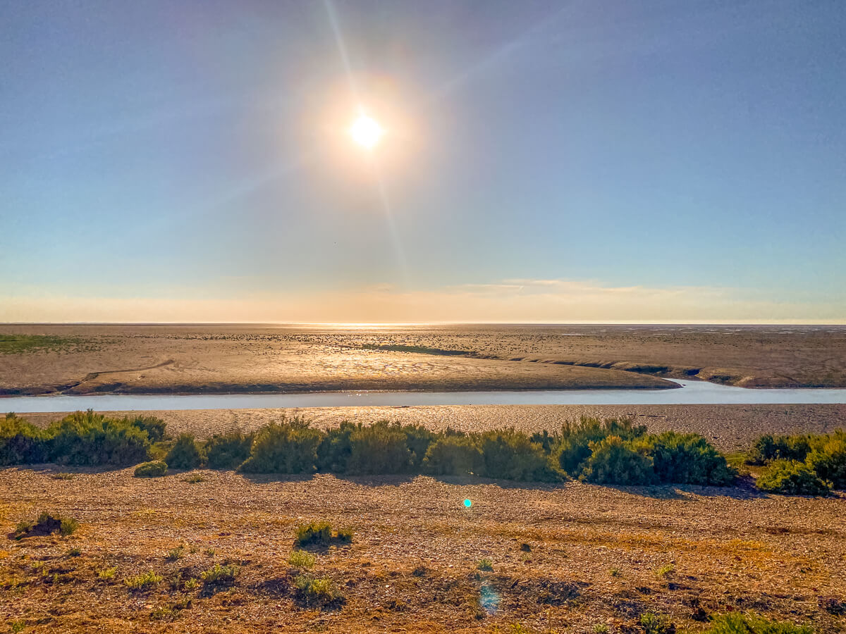 sun shining over the mudflats of the Wash