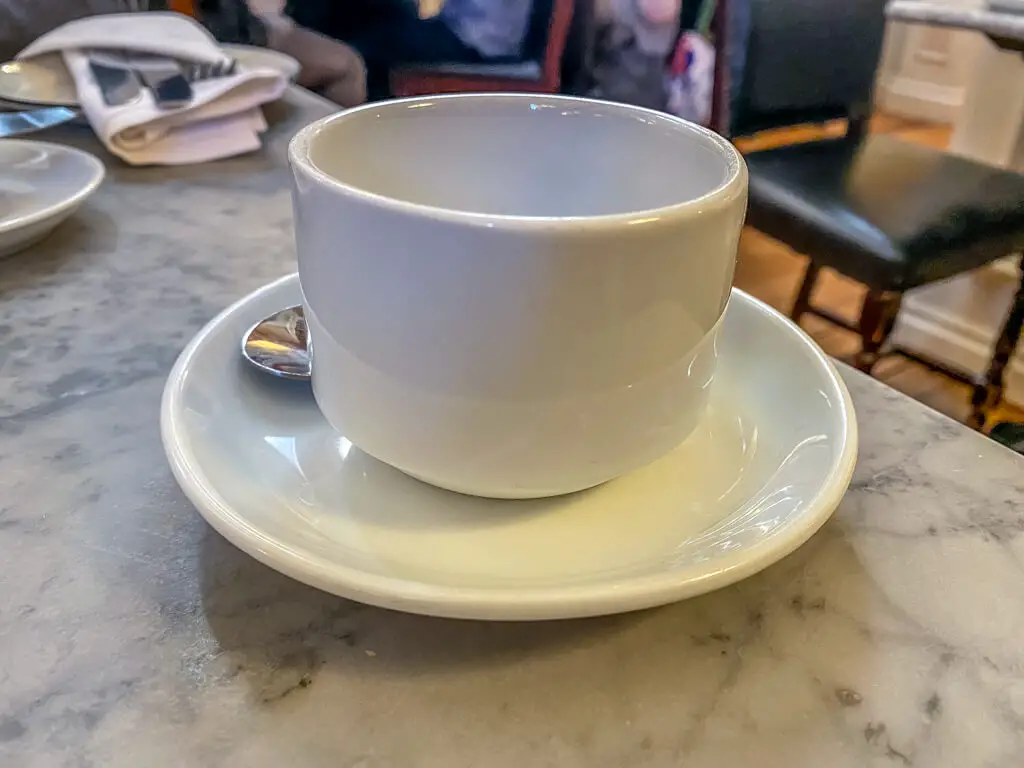 white cup and saucer