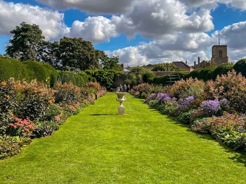 Herbaceous Borders, grass in the middle of two rows of colourful flowers