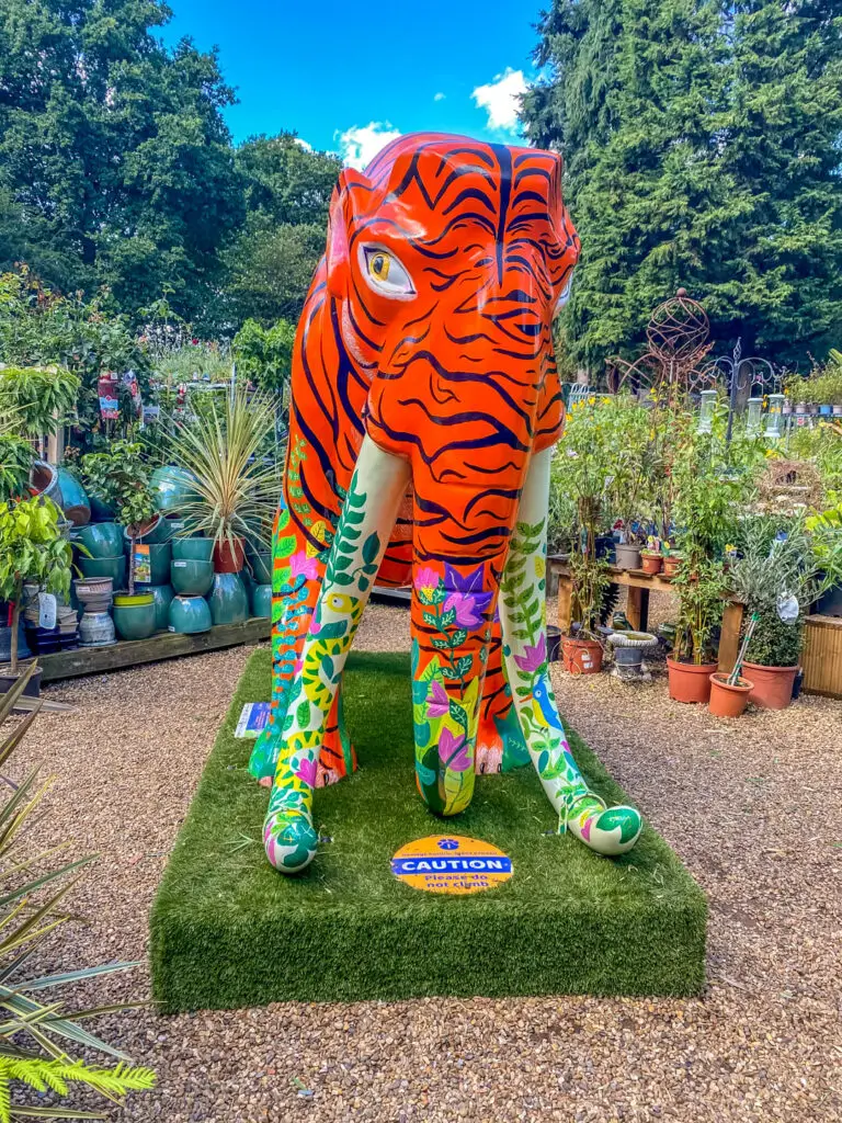 mammoth with tiger print and floral design on lower body