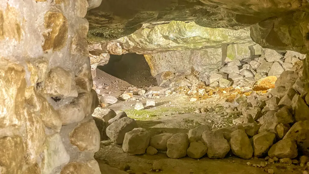 inside the pit at Grimes Graves where you can see tunnels and stones