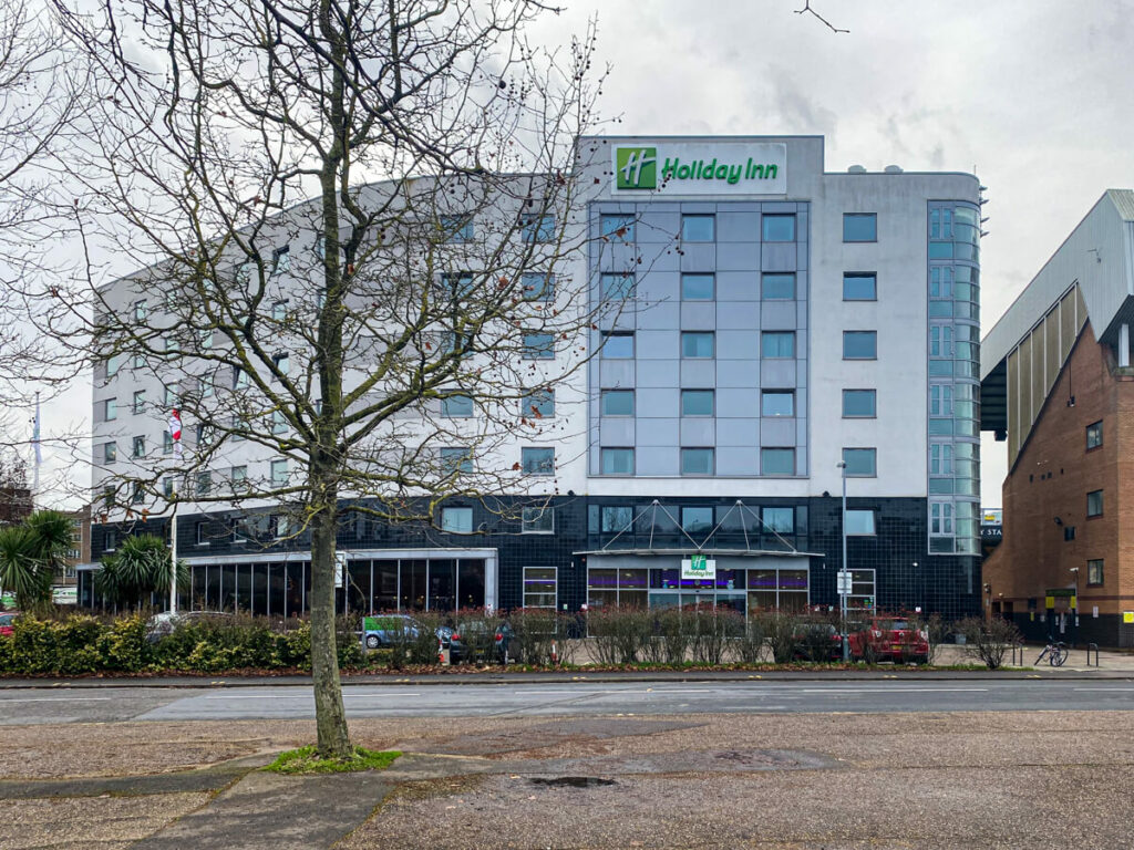 exterior of the holiday inn norwich city with a tree in front