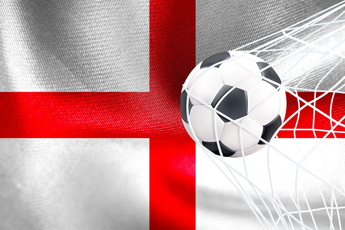 england flag background with football going into net