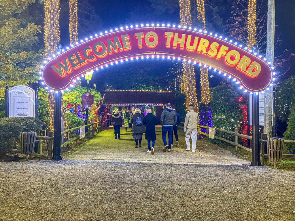 sign saying "welcome to thursford" in colourful lights