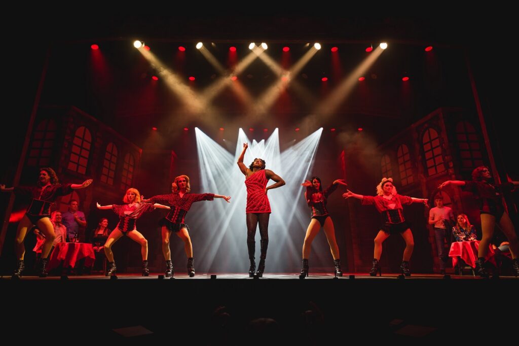 Lola and the Angels dancing on the Norwich Theatre Royal Stage in Kinky Boots