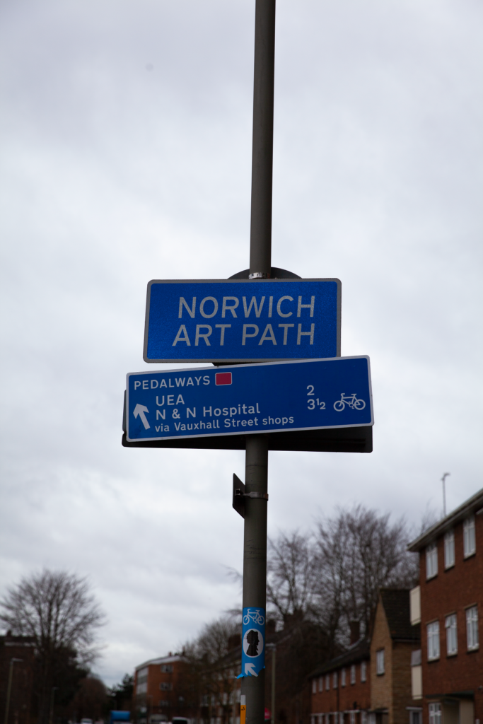 blue sign for norwich arts path