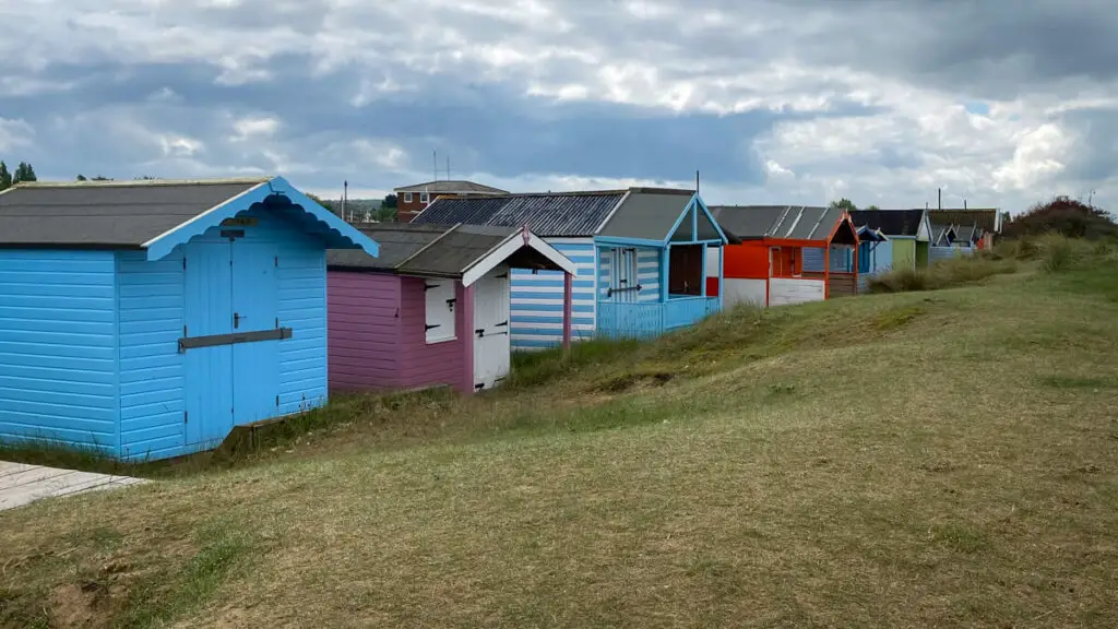 the row of beach huts at north heacham beach