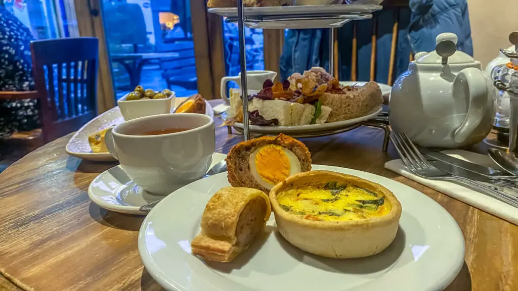 view of the savoury items with tea in the background