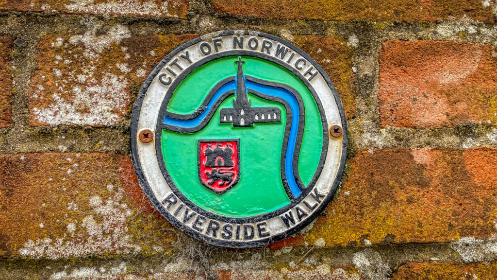 plaque that says city of norwich, riverside walk