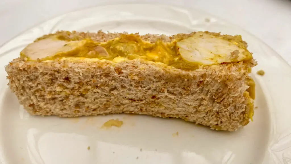 closeup of the coronation chicken sandwich at the maids head hotel