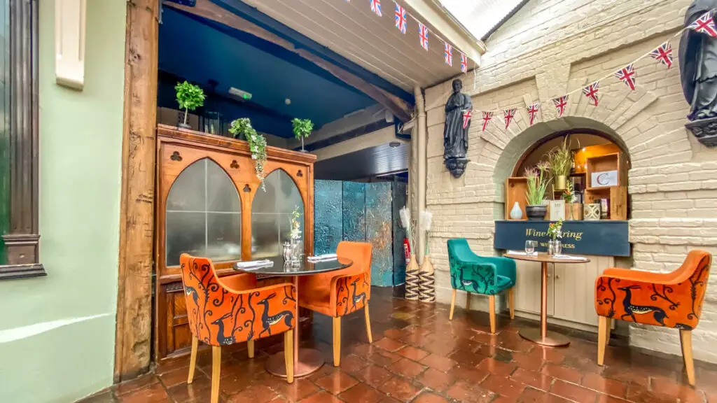 tables in the Winepress restaurant at the maids head hotel