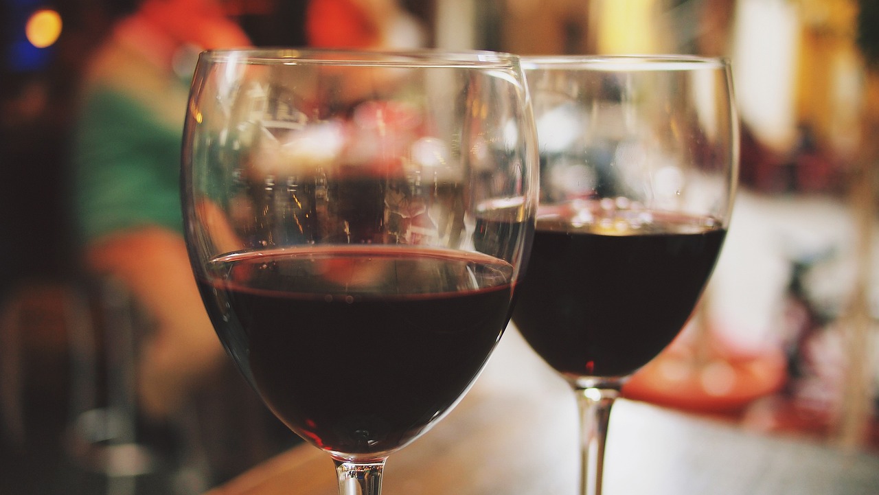 two glasses of red wine with blurred background