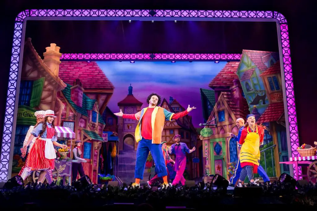 Aladdin front and centre in a colourful costume during the panto at Norwich Theatre Royal